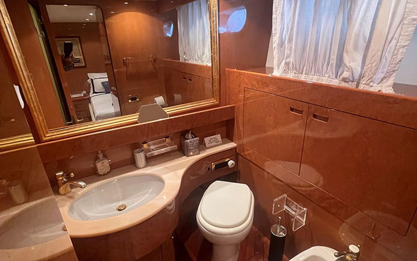 a bathroom with a toilet and a sink aboard IT'S A DREAM Yacht for Sale