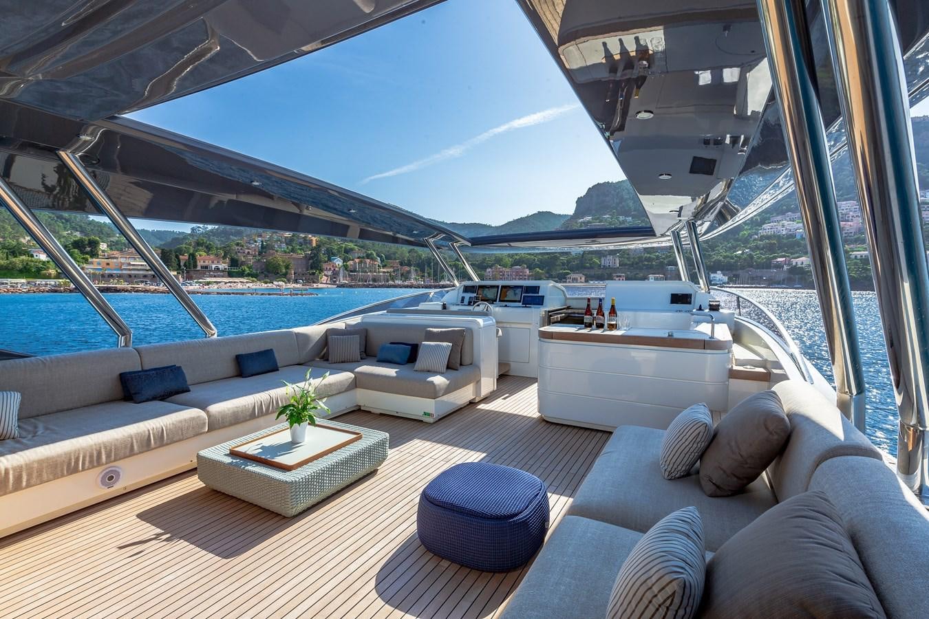 a living room with a large balcony aboard ESMERALDA OF THE SEAS Yacht for Sale