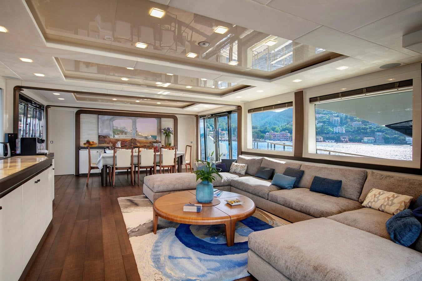 a living room with a large window aboard ESMERALDA OF THE SEAS Yacht for Sale