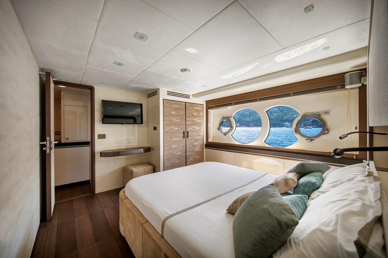 a person lying on a bed aboard ESMERALDA OF THE SEAS Yacht for Sale