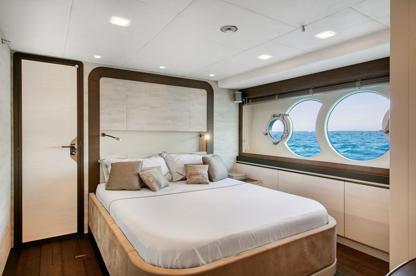 a bedroom with a large bed aboard ESMERALDA OF THE SEAS Yacht for Sale