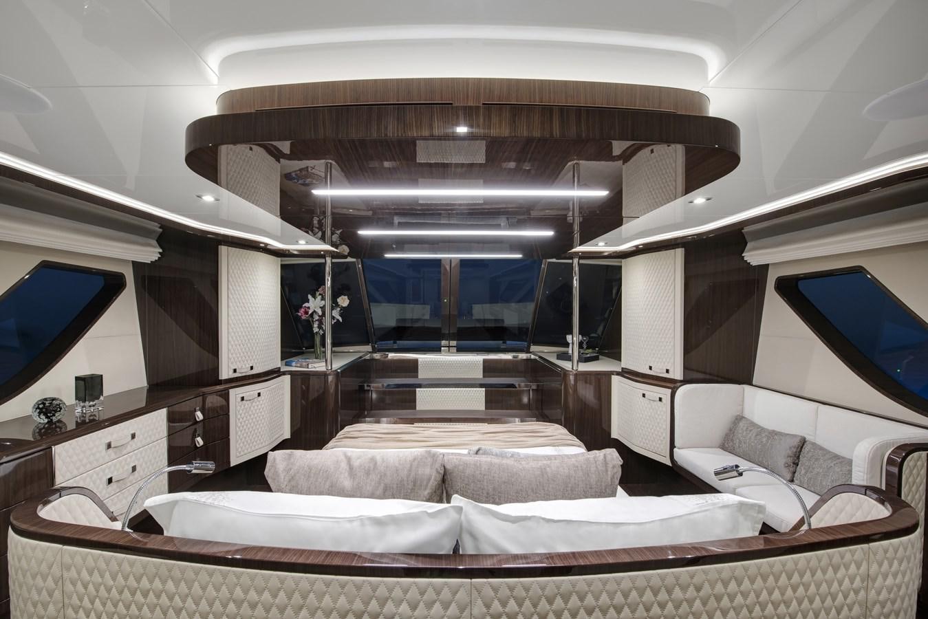 a room with a bed and a large window aboard DEMO Yacht for Sale