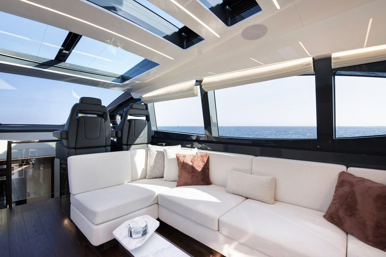 a room with a couch and a chair aboard DEMO Yacht for Sale