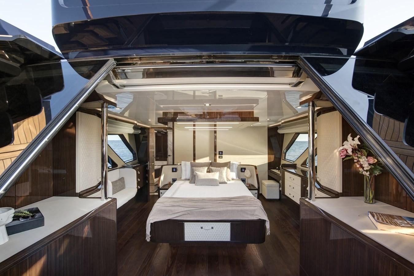 a room with a bed and a desk aboard DEMO Yacht for Sale