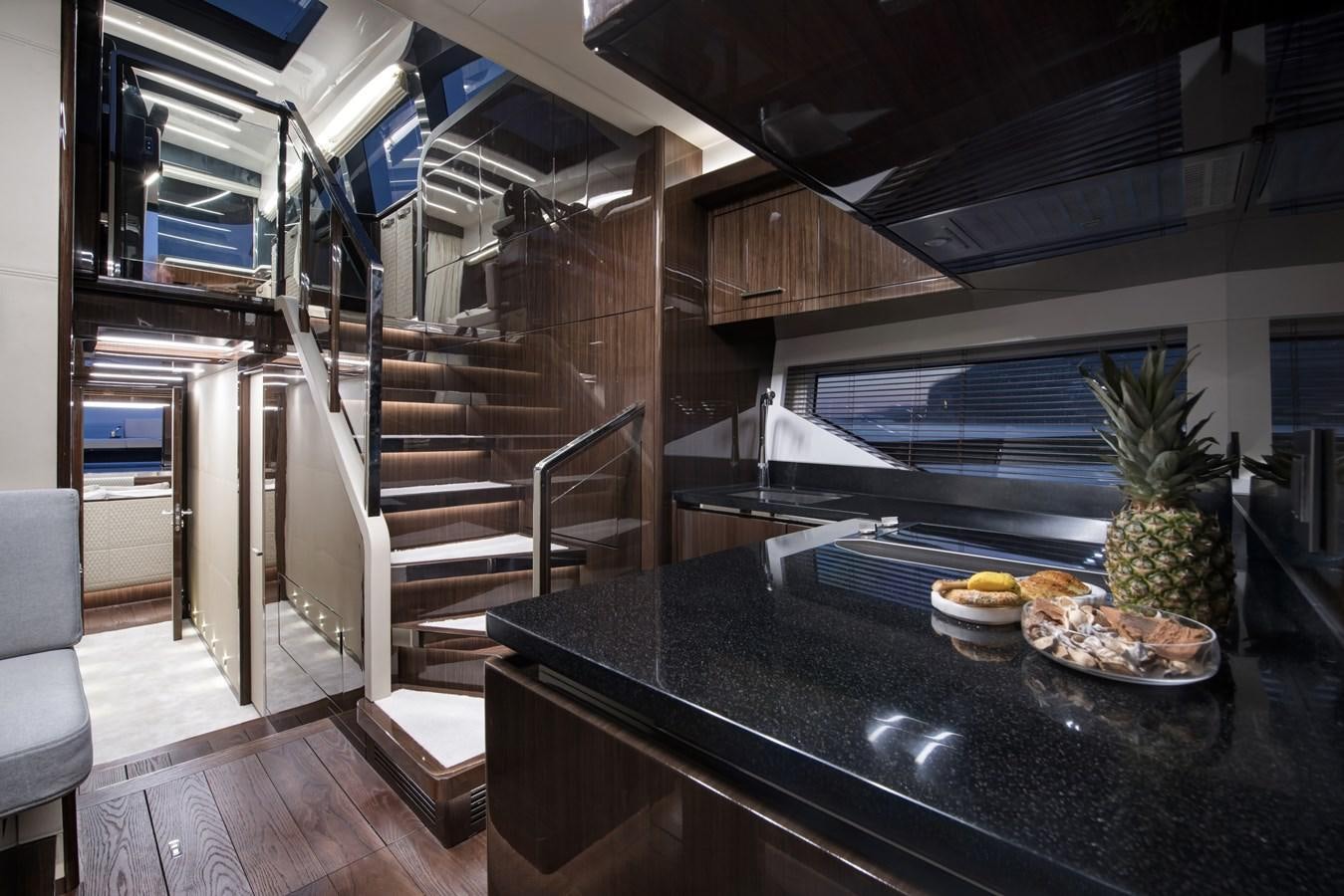 a kitchen with a large black counter aboard DEMO Yacht for Sale