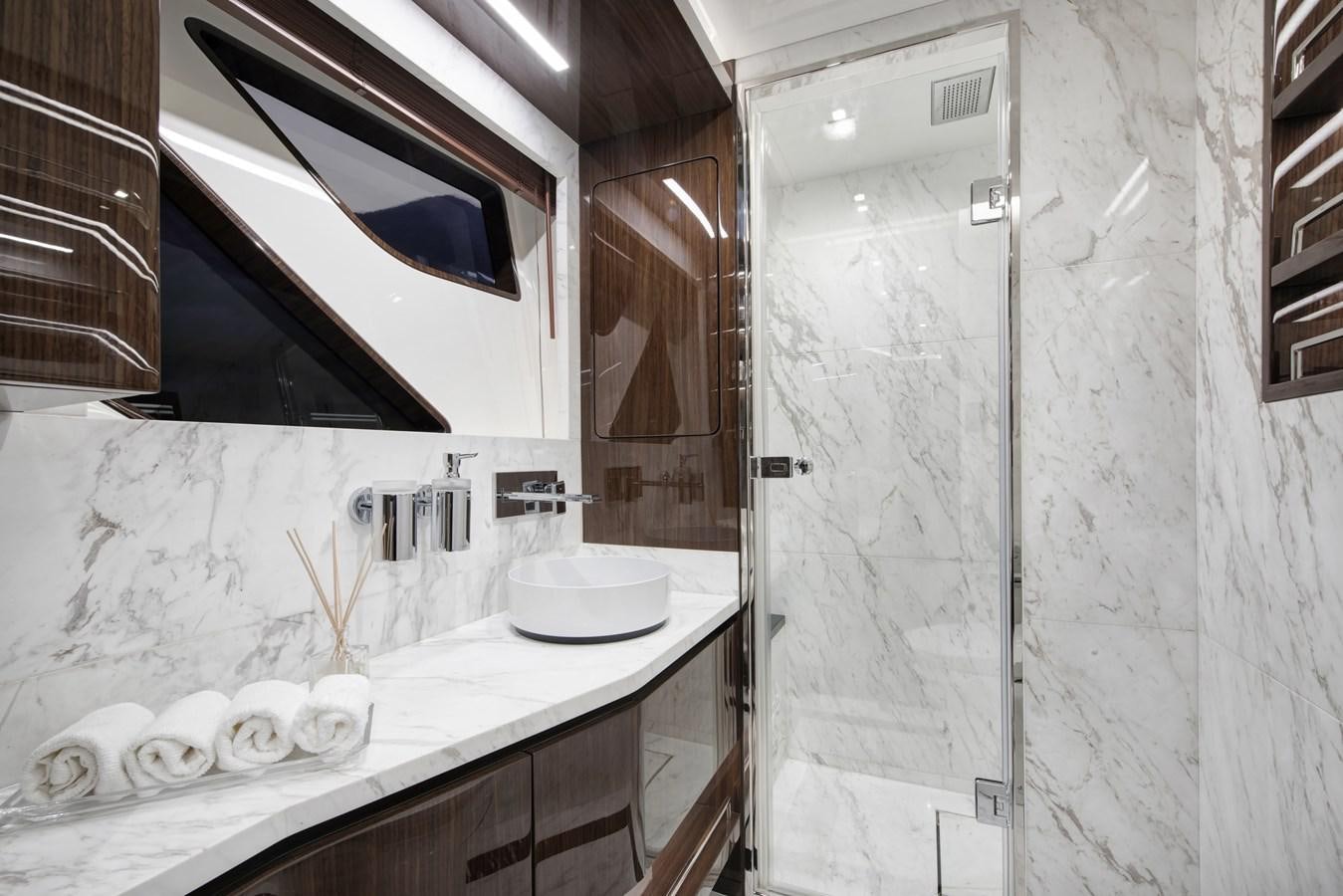 a bathroom with a sink and a mirror aboard DEMO Yacht for Sale