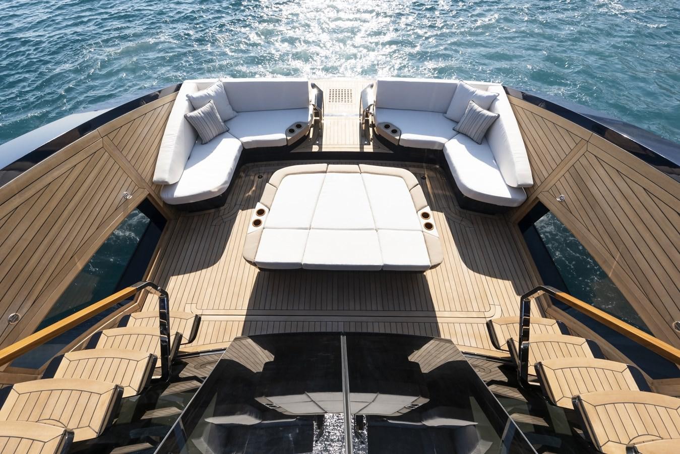 a deck with chairs and a pool aboard DEMO Yacht for Sale