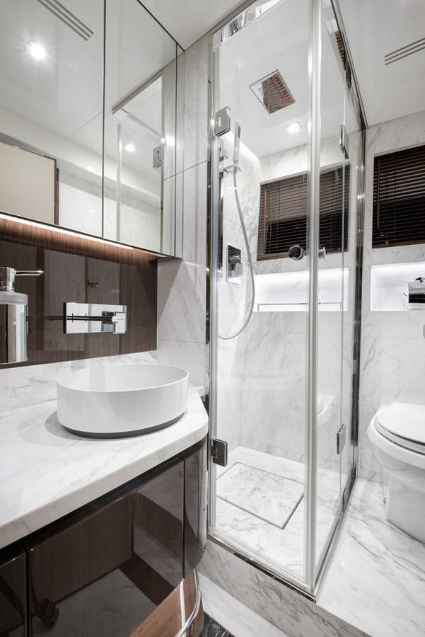 a bathroom with a sink and shower aboard DEMO Yacht for Sale
