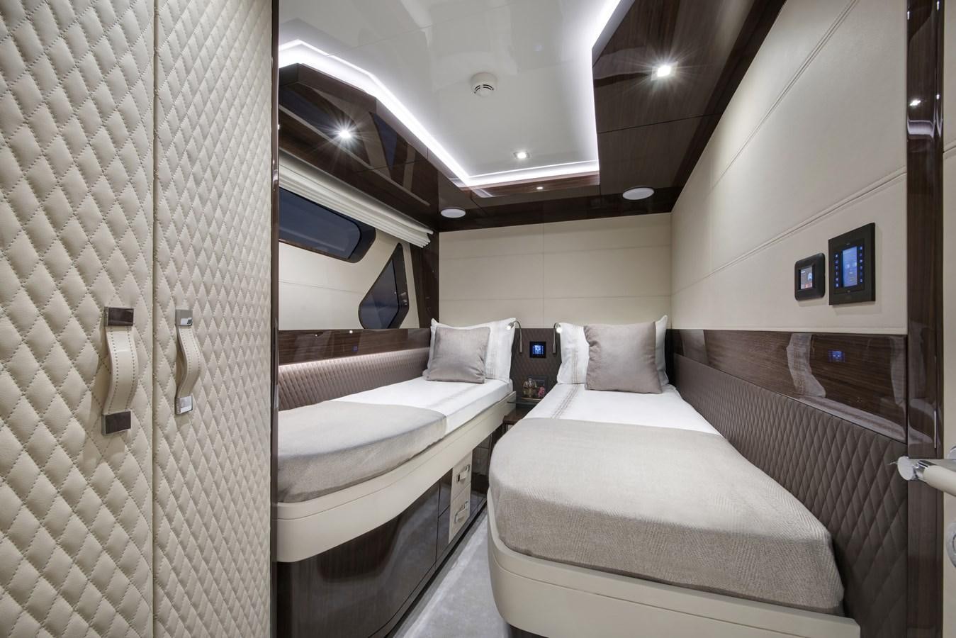 a couple of beds in a hotel room aboard DEMO Yacht for Sale