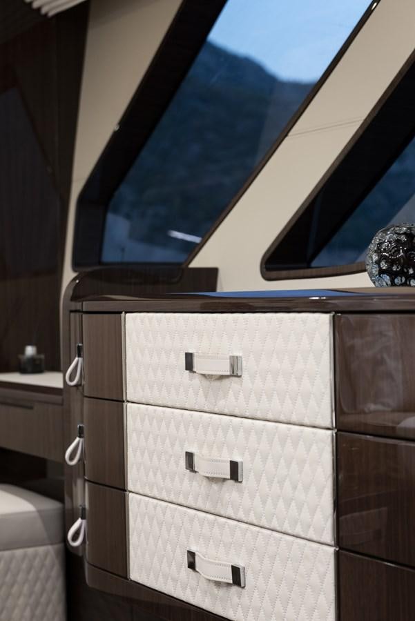 a dresser with a mirror above it aboard DEMO Yacht for Sale