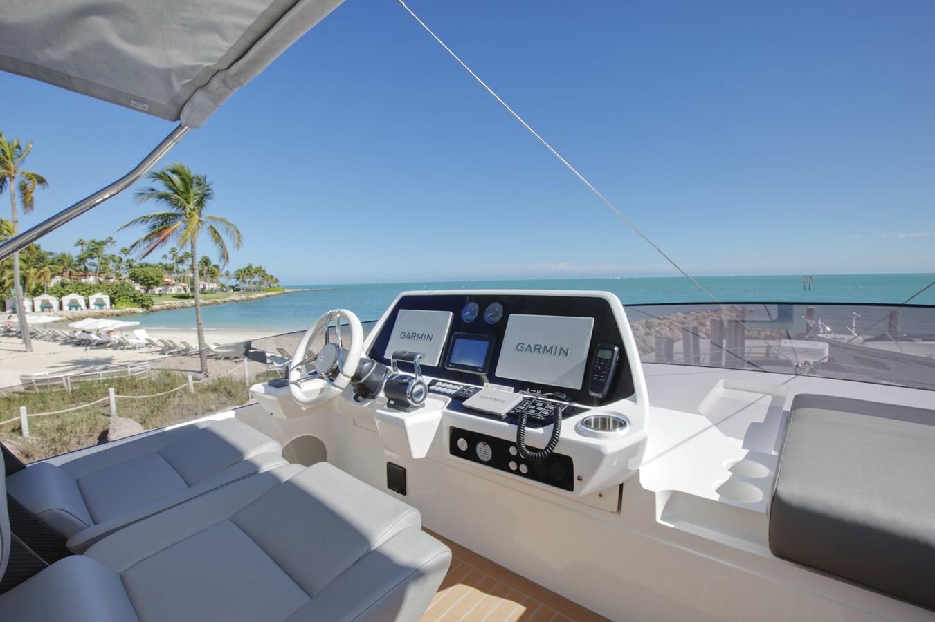 a white car on a beach aboard HIDE OUT Yacht for Sale