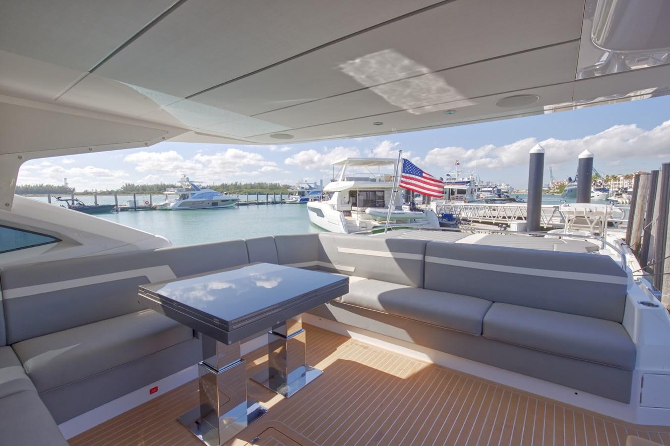 a room with a table and chairs aboard HIDE OUT Yacht for Sale
