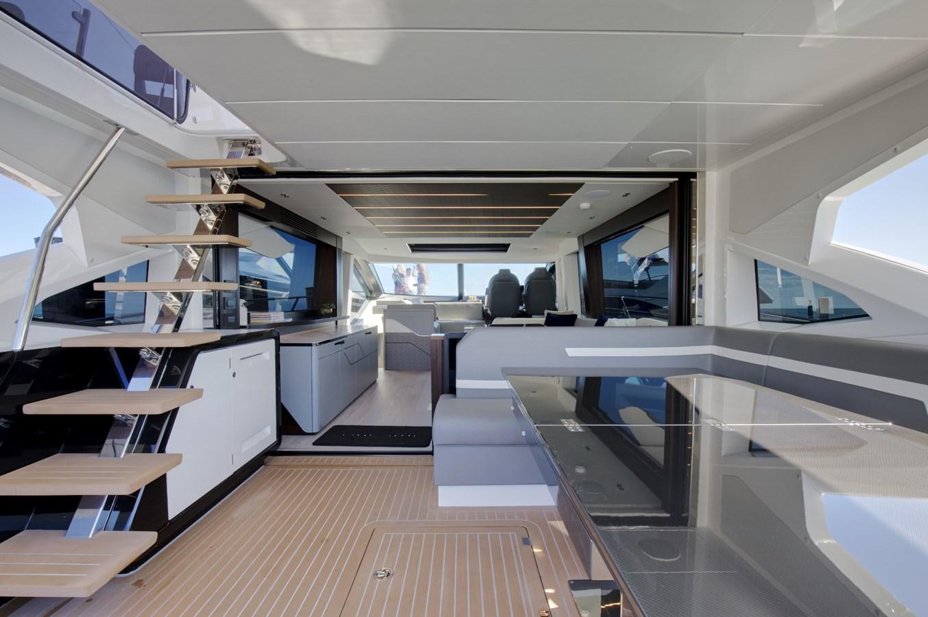 a room with a wood floor and white cabinets aboard HIDE OUT Yacht for Sale