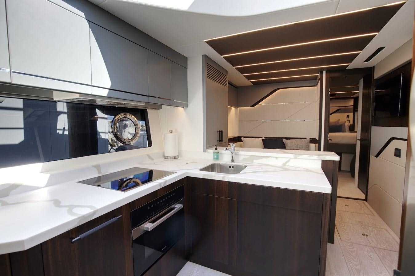 a kitchen with a large island aboard HIDE OUT Yacht for Sale