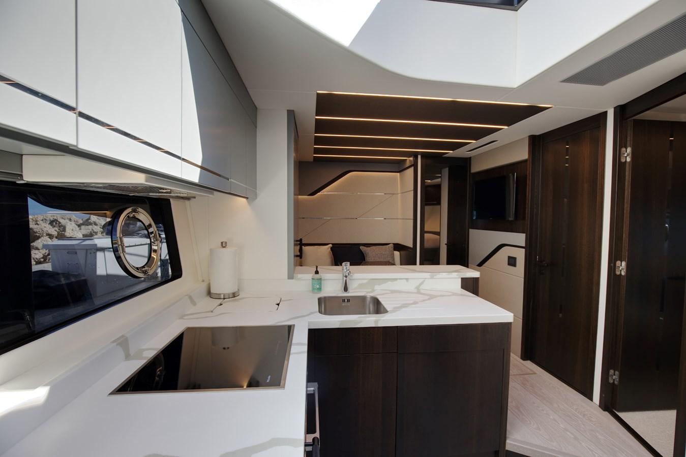 a kitchen with a sink and cabinets aboard HIDE OUT Yacht for Sale