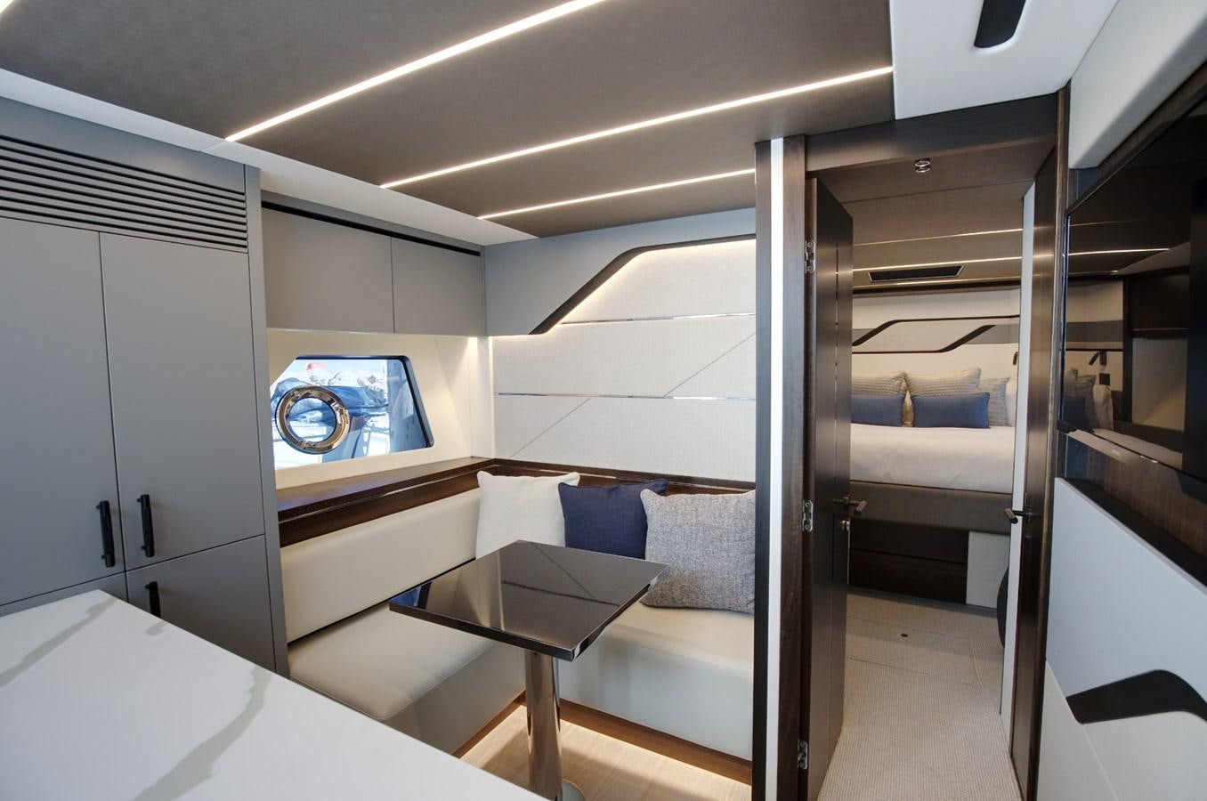 a room with a bed and a desk aboard HIDE OUT Yacht for Sale