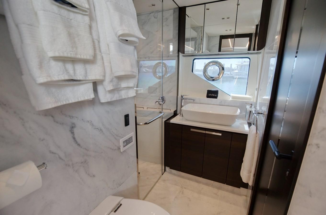 a bathroom with a sink and a mirror aboard HIDE OUT Yacht for Sale