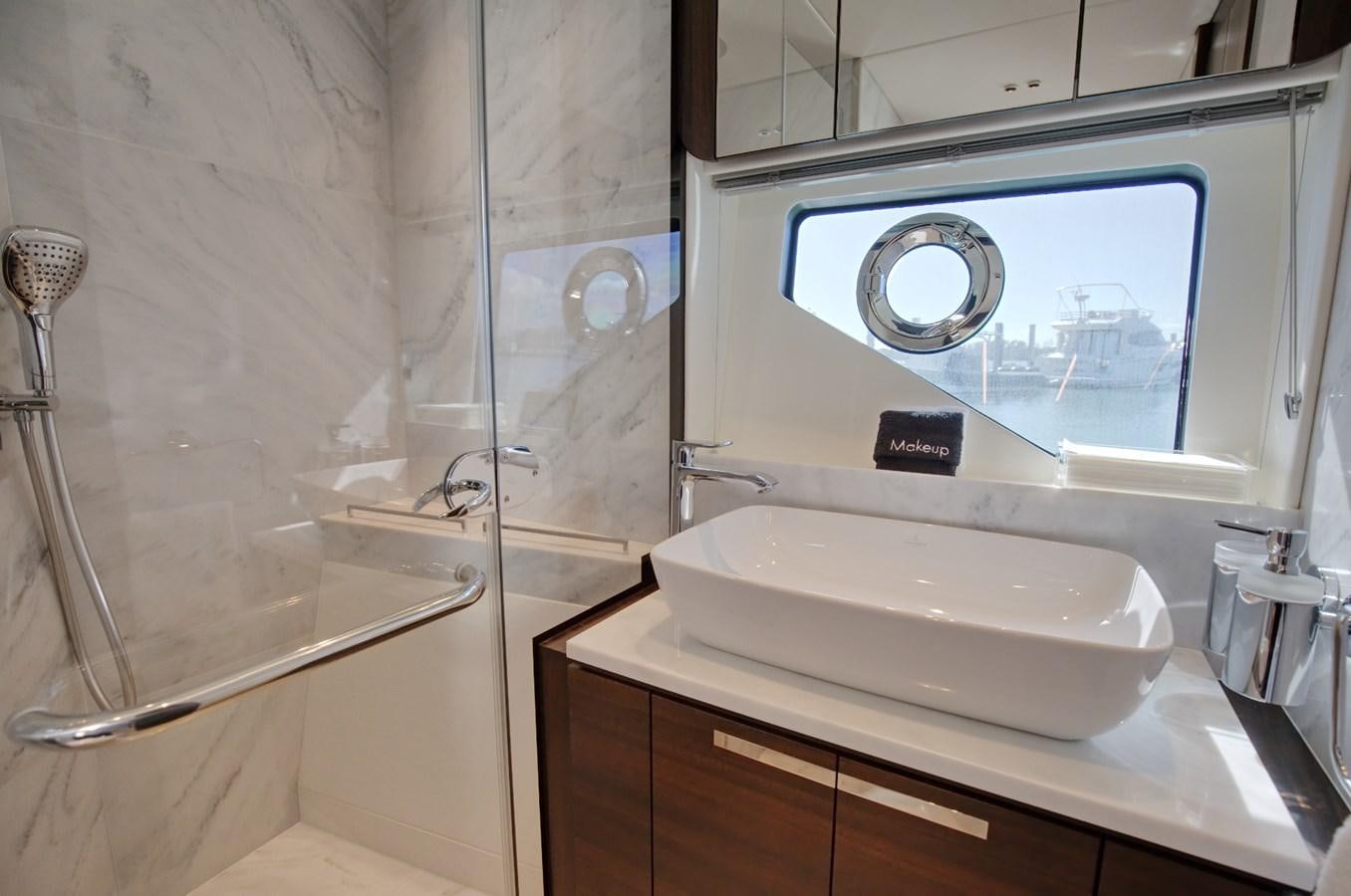 a bathroom with a sink and a mirror aboard HIDE OUT Yacht for Sale