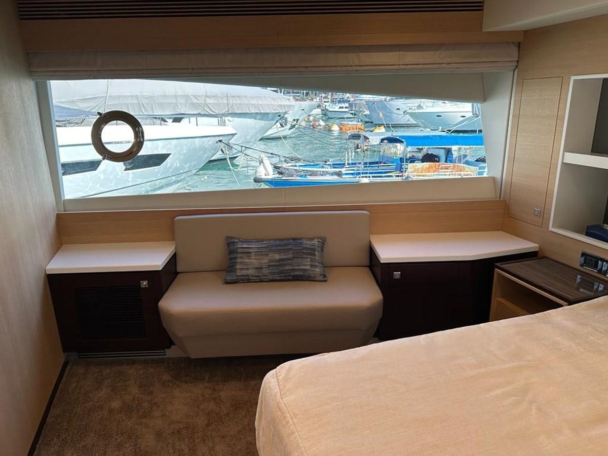 a room with a bed and a large window aboard BLACK SOIL Yacht for Sale