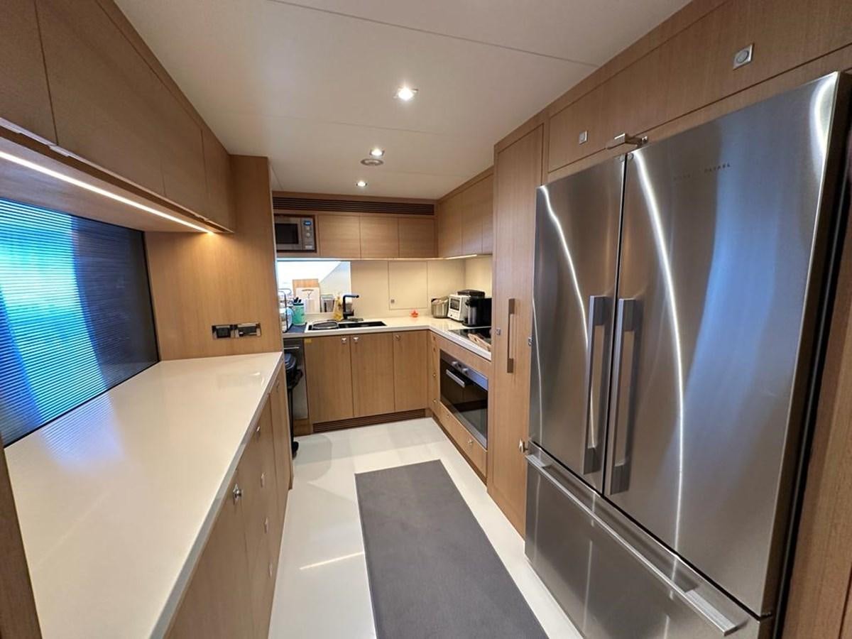 a kitchen with stainless steel appliances aboard BLACK SOIL Yacht for Sale