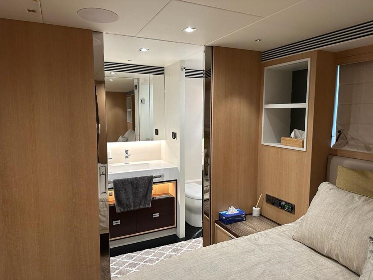a bedroom with a bed and a closet aboard BLACK SOIL Yacht for Sale