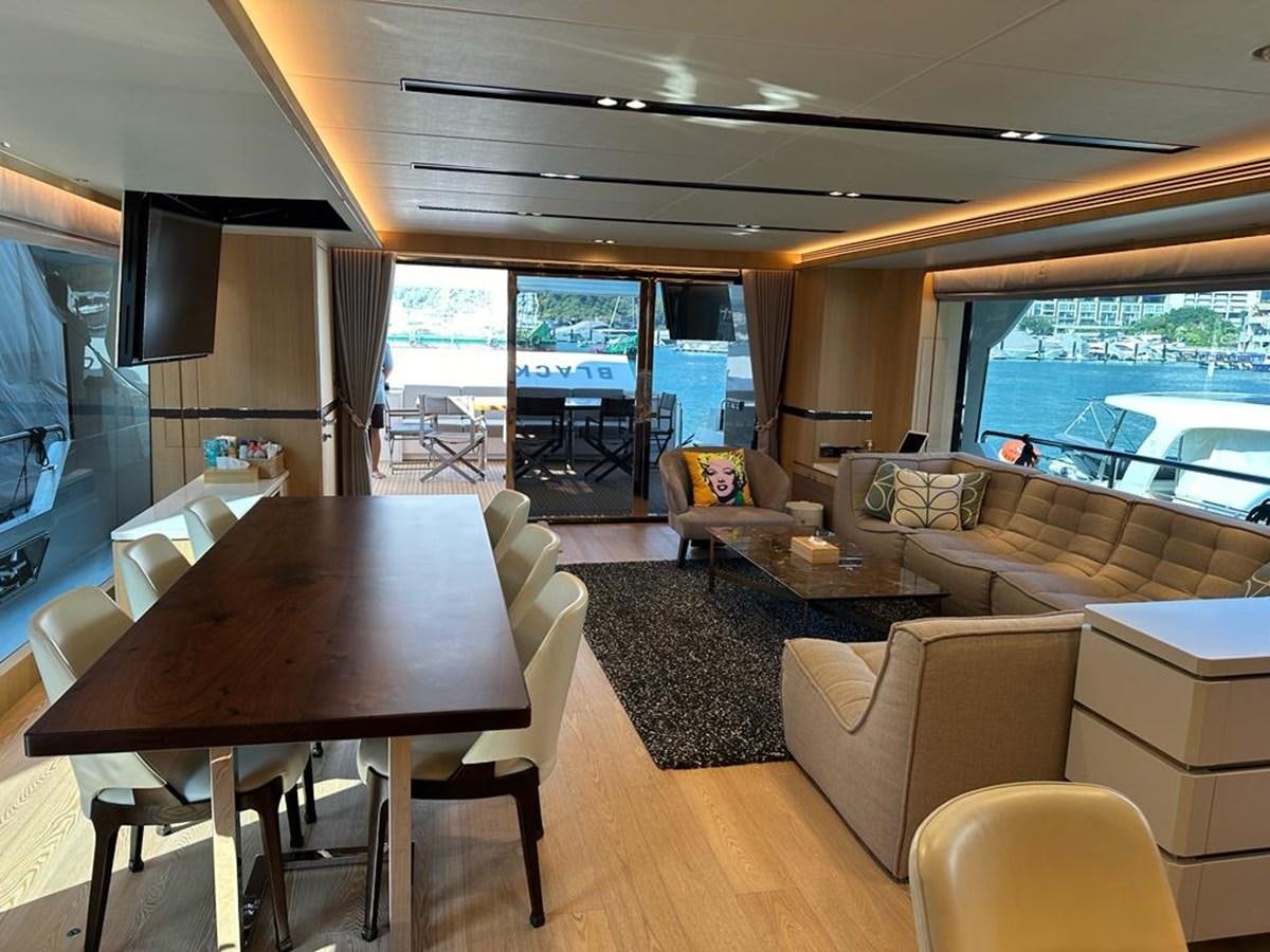 a living room with a large window aboard BLACK SOIL Yacht for Sale