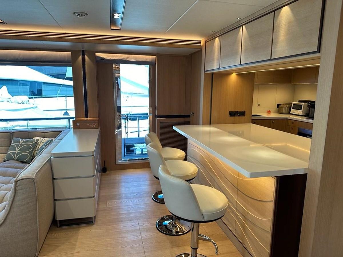 a room with a table and chairs aboard BLACK SOIL Yacht for Sale