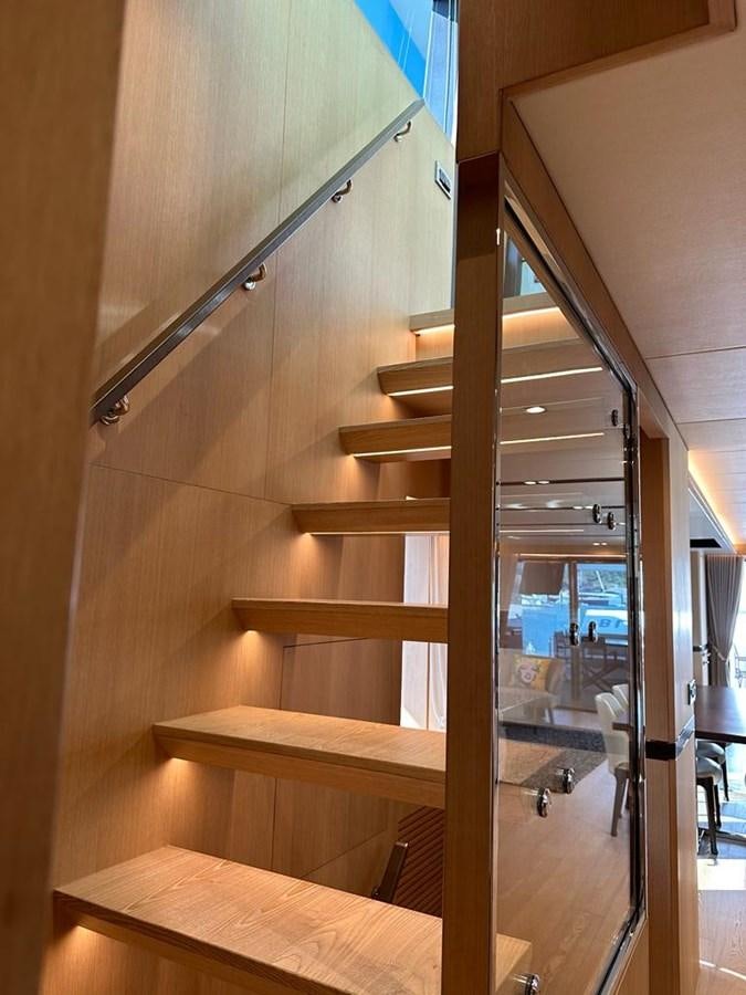 a wooden staircase in a house aboard BLACK SOIL Yacht for Sale