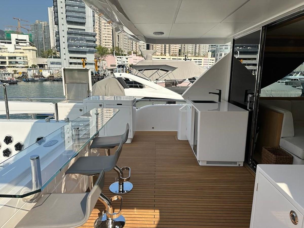 a deck with a view of a city and water aboard BLACK SOIL Yacht for Sale