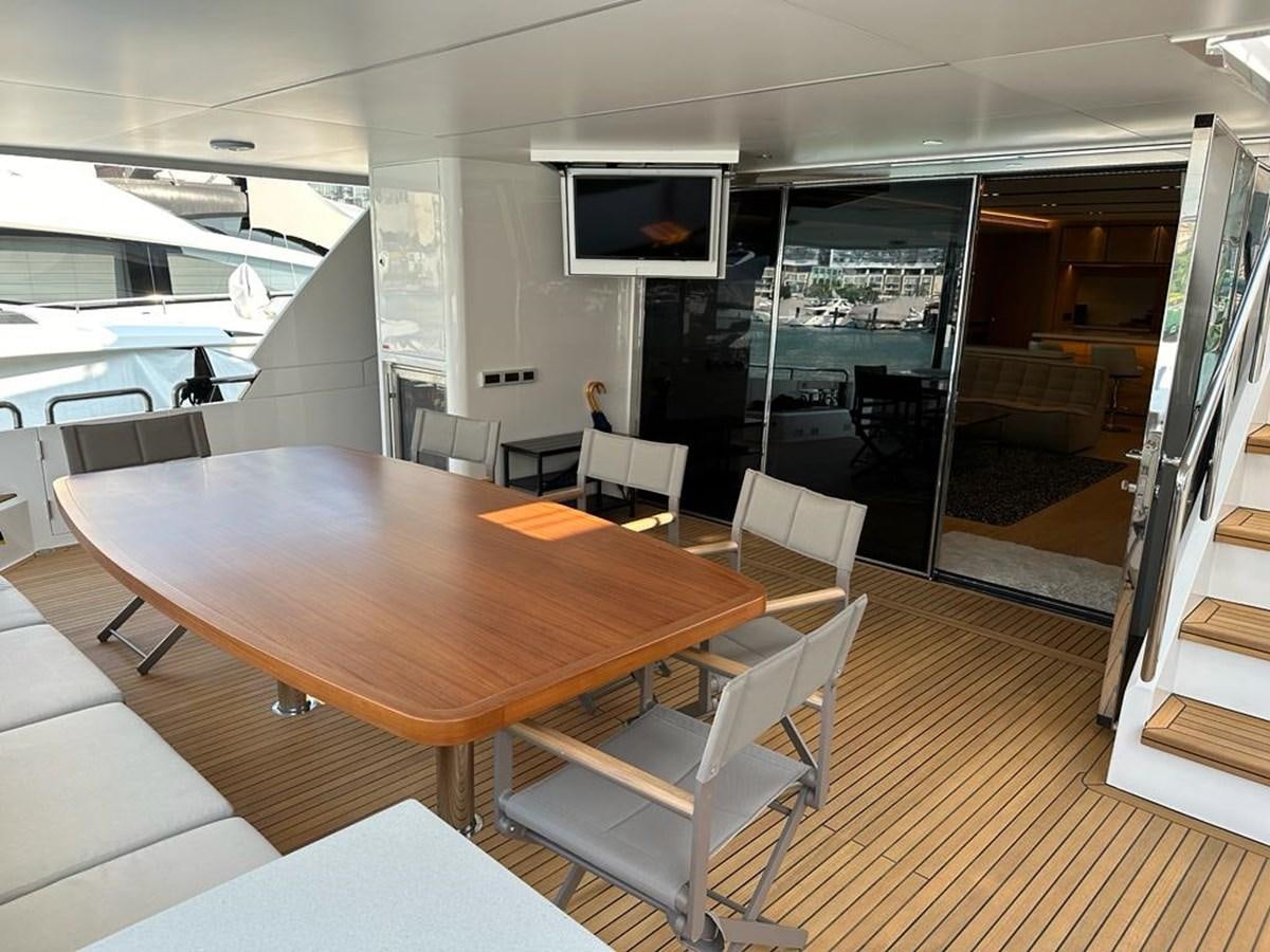 a conference room with a table and chairs aboard BLACK SOIL Yacht for Sale