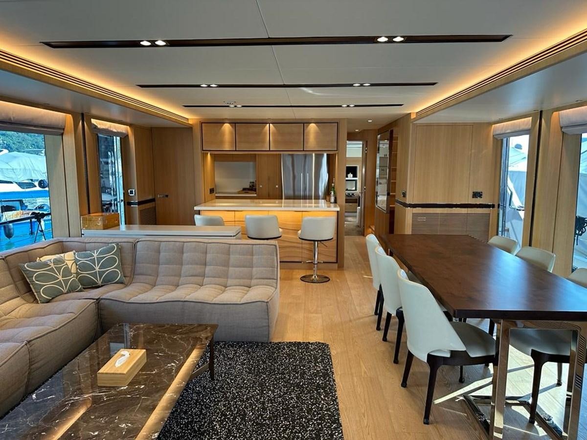 a living room with a couch and a table aboard BLACK SOIL Yacht for Sale