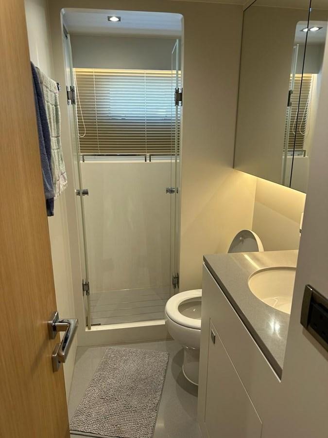 a bathroom with a glass shower door aboard BLACK SOIL Yacht for Sale