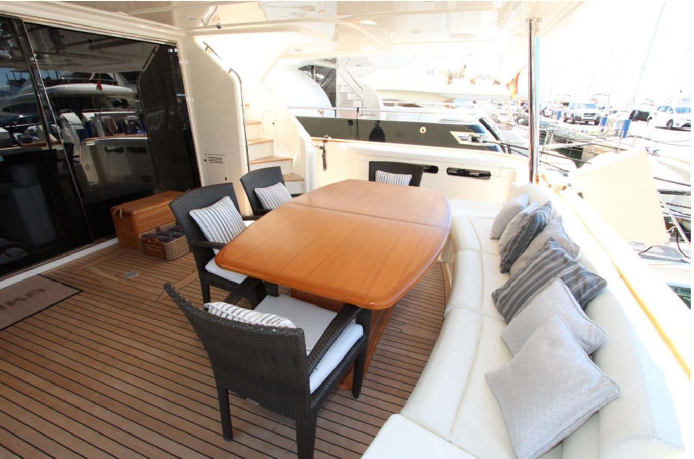 a room with a table and chairs aboard ALL WE NEED FOR TODAY Yacht for Sale