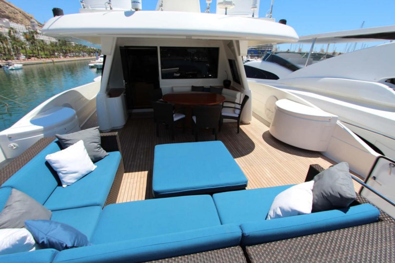 a boat with a table and chairs on a deck aboard ALL WE NEED FOR TODAY Yacht for Sale
