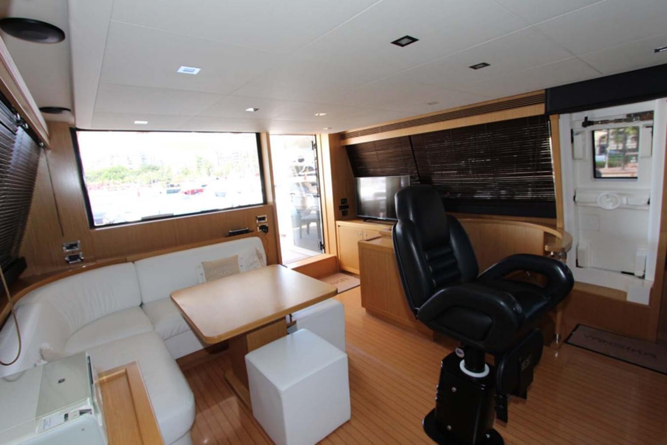 a living room with a leather chair aboard ALL WE NEED FOR TODAY Yacht for Sale