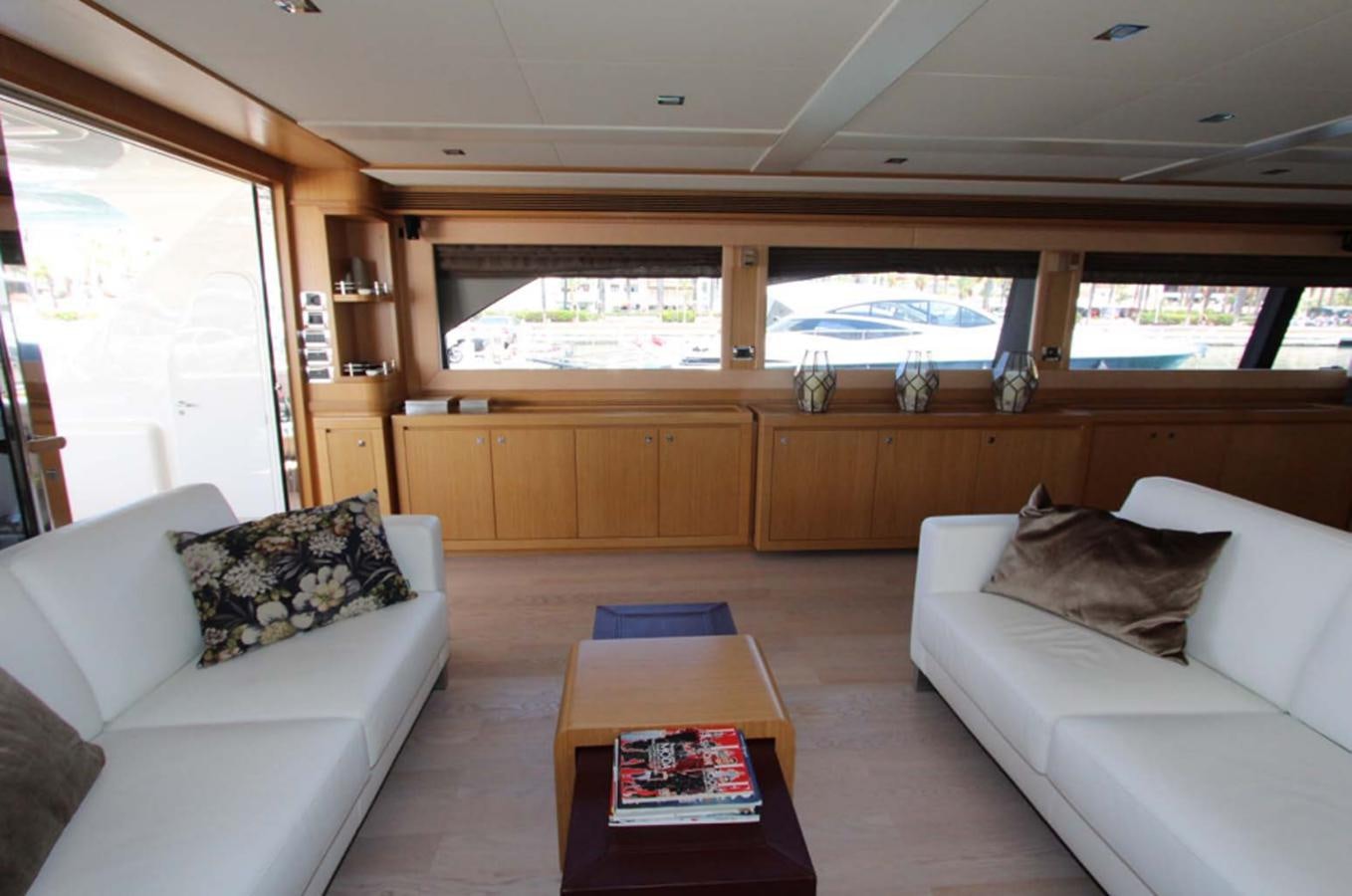 a living room with a couch and a table aboard ALL WE NEED FOR TODAY Yacht for Sale