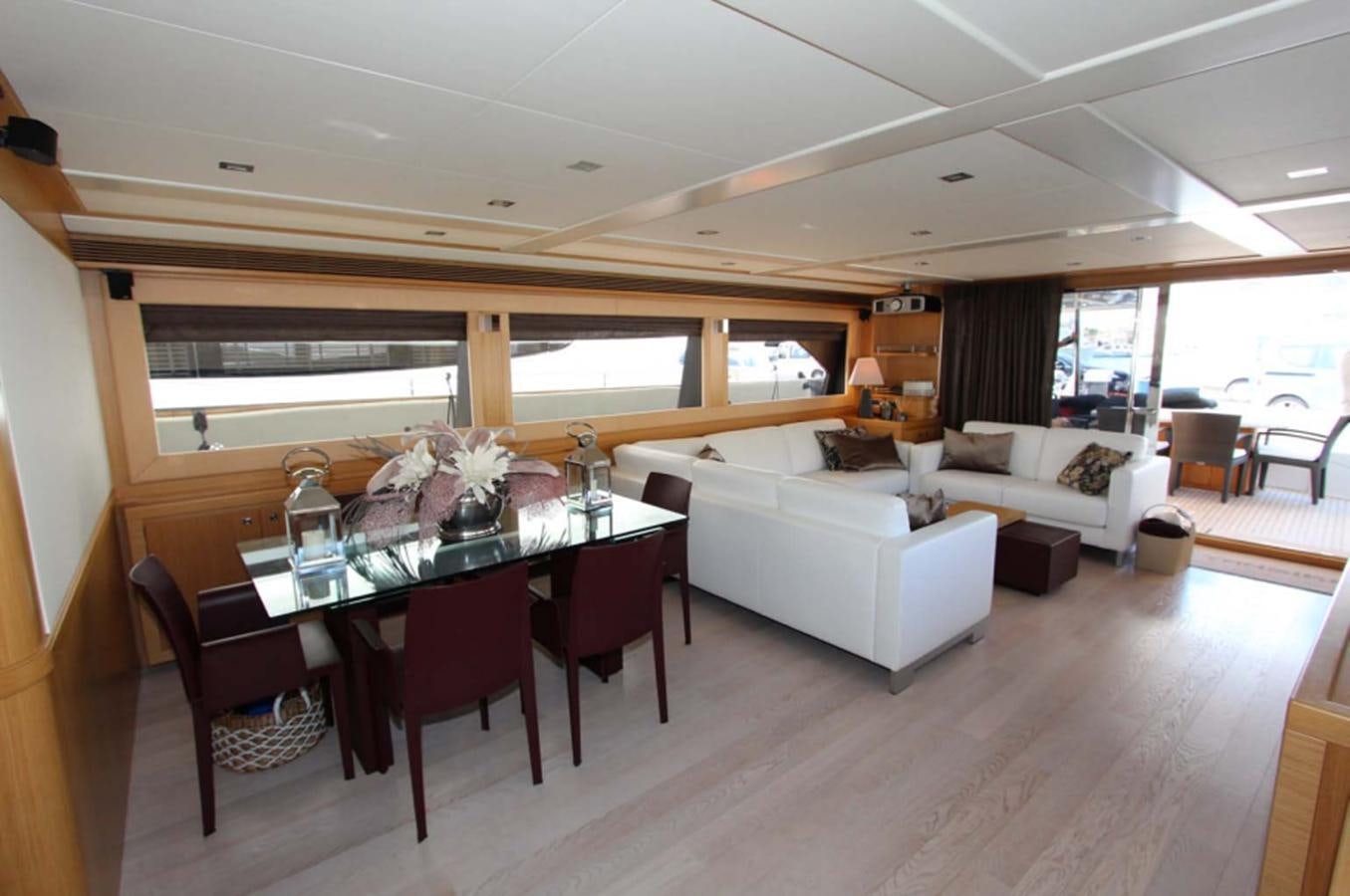 a dining room with a table and chairs aboard ALL WE NEED FOR TODAY Yacht for Sale