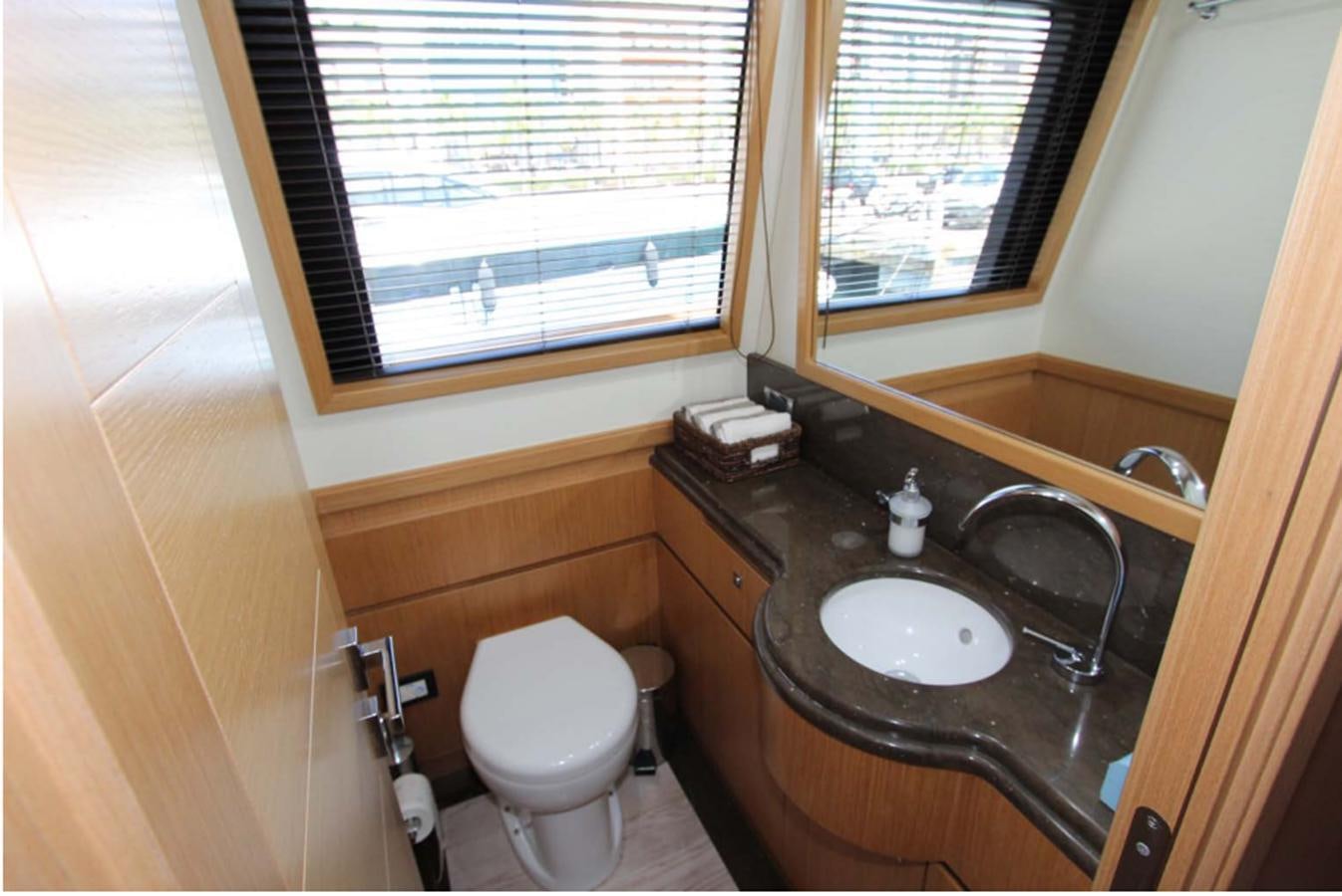 a bathroom with a sink and a toilet aboard ALL WE NEED FOR TODAY Yacht for Sale