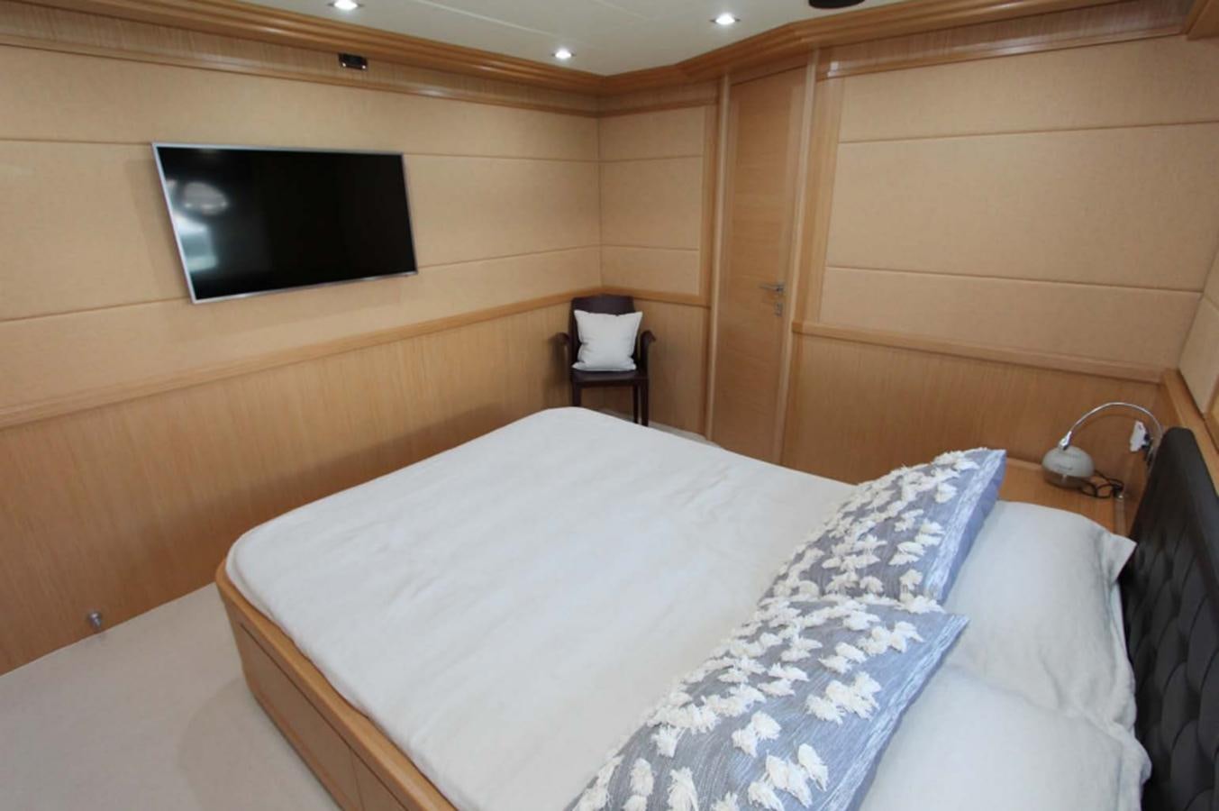 a bed with a white pillow aboard ALL WE NEED FOR TODAY Yacht for Sale