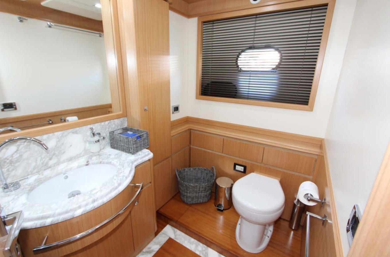 a bathroom with a sink and toilet aboard ALL WE NEED FOR TODAY Yacht for Sale