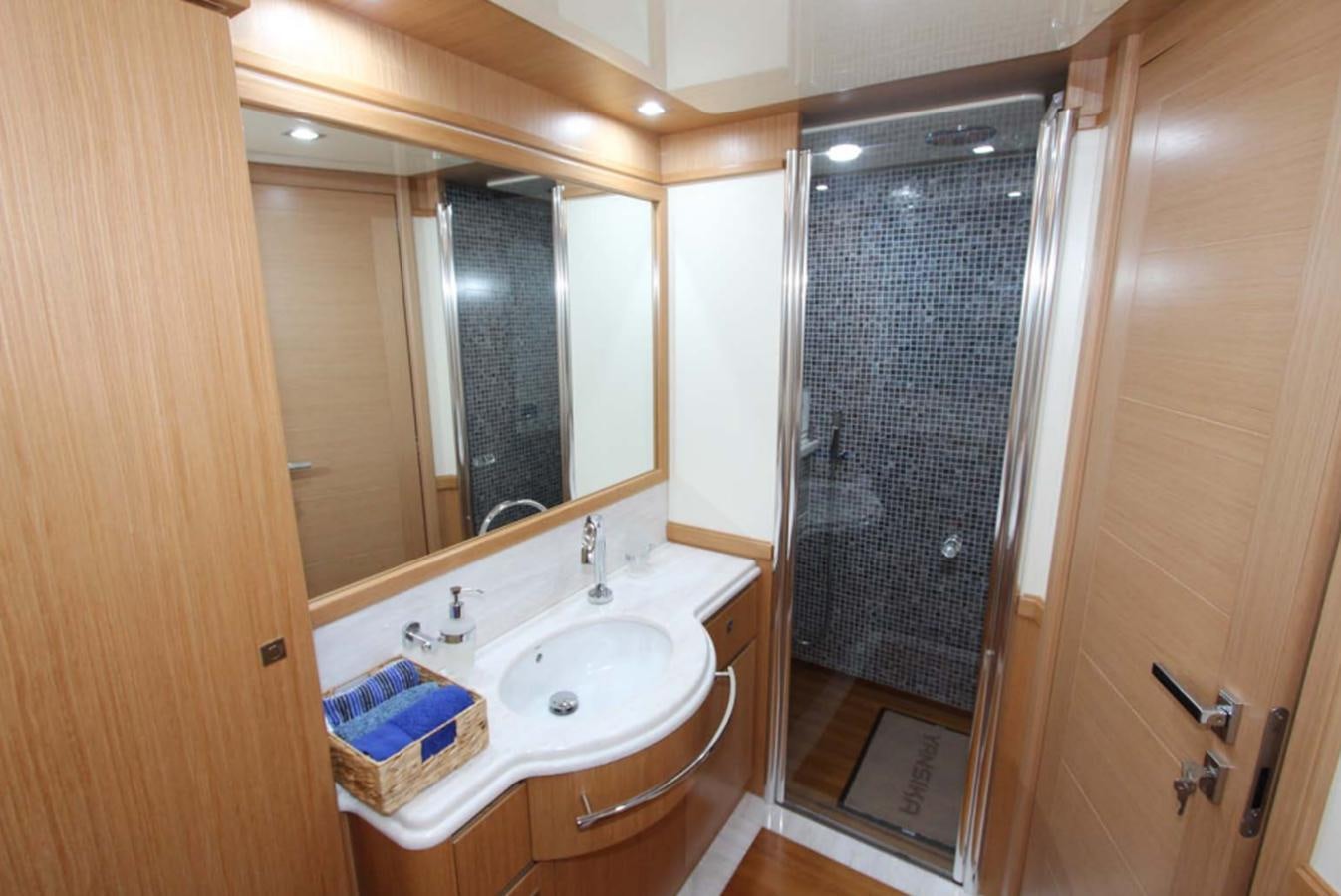 a bathroom with a sink and a shower aboard ALL WE NEED FOR TODAY Yacht for Sale