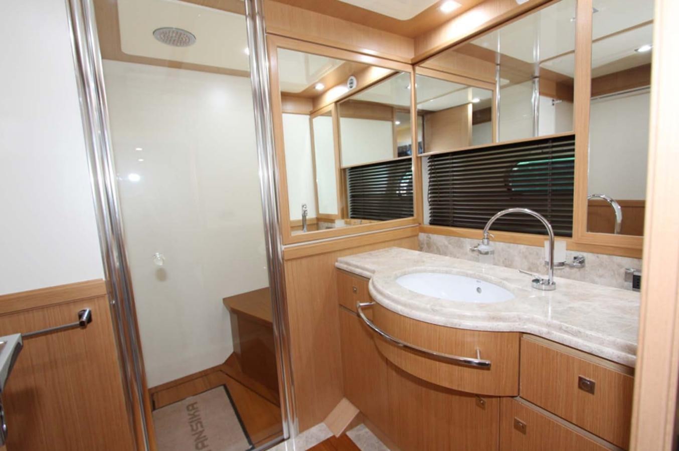 a bathroom with a sink and a mirror aboard ALL WE NEED FOR TODAY Yacht for Sale