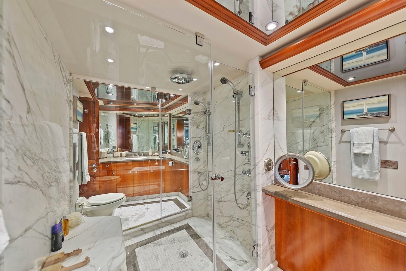 a bathroom with a shower and toilet aboard DESPERADO Yacht for Sale