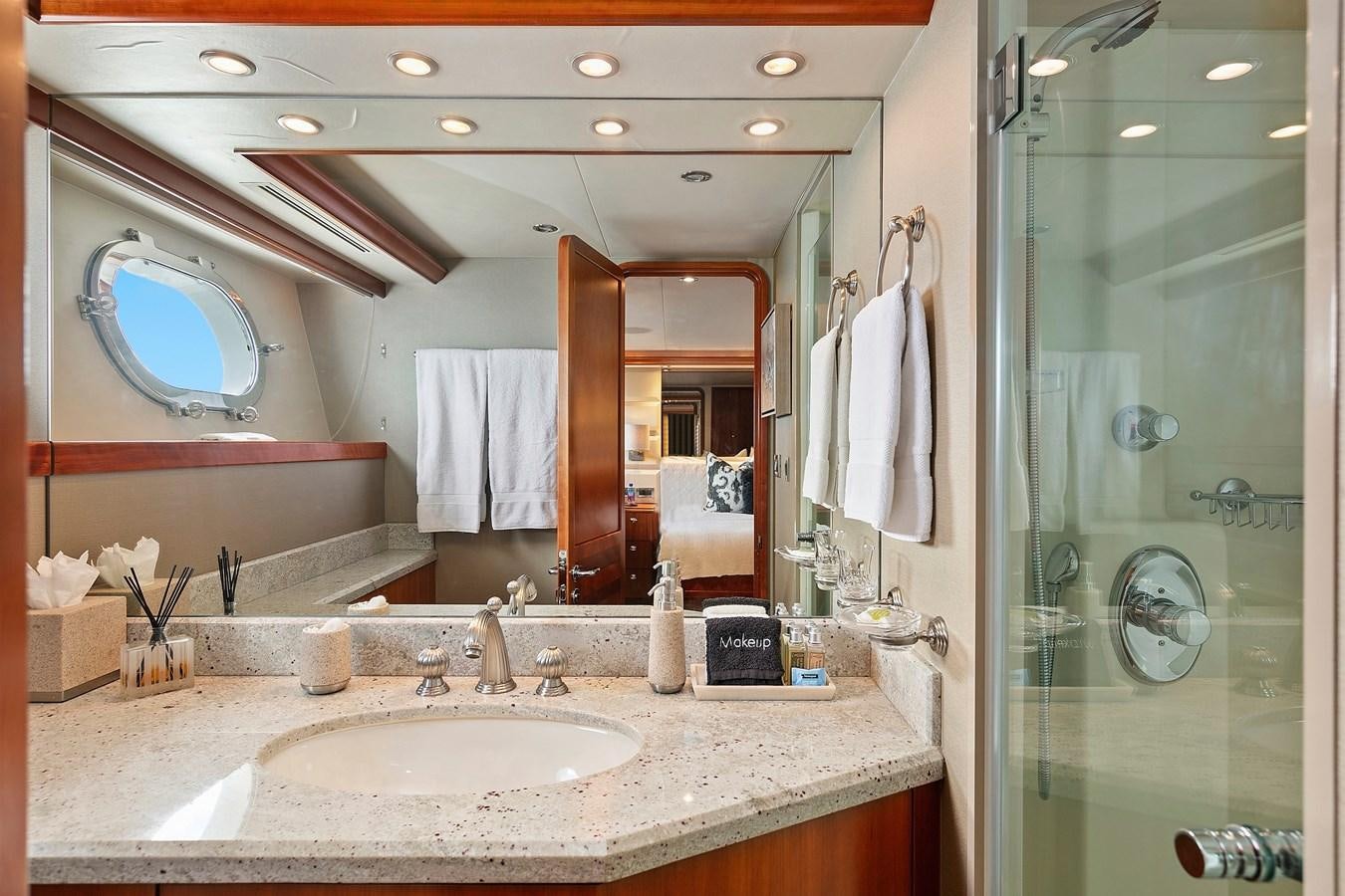 a bathroom with a large mirror aboard DESPERADO Yacht for Sale