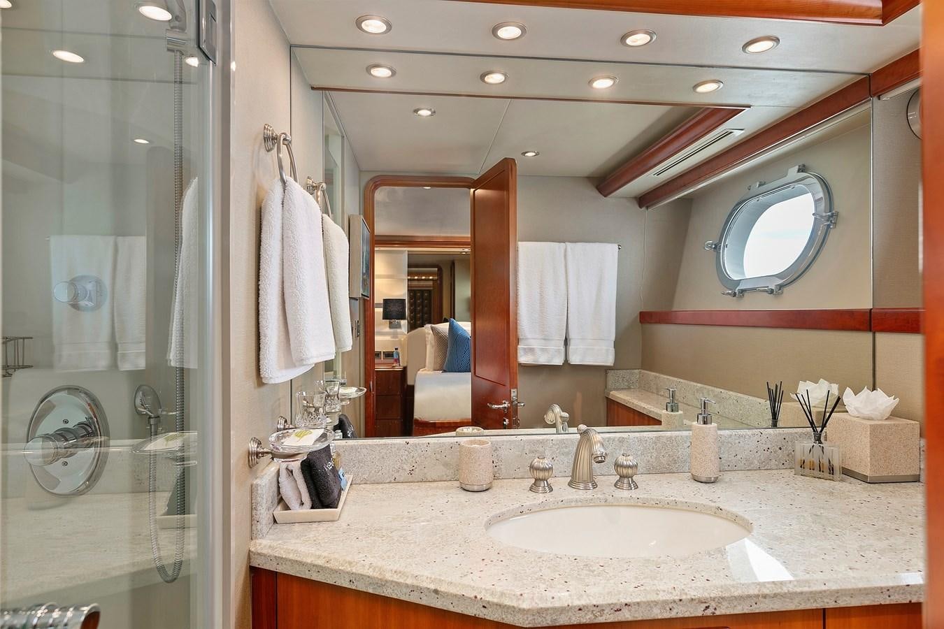 a bathroom with a large mirror aboard DESPERADO Yacht for Sale