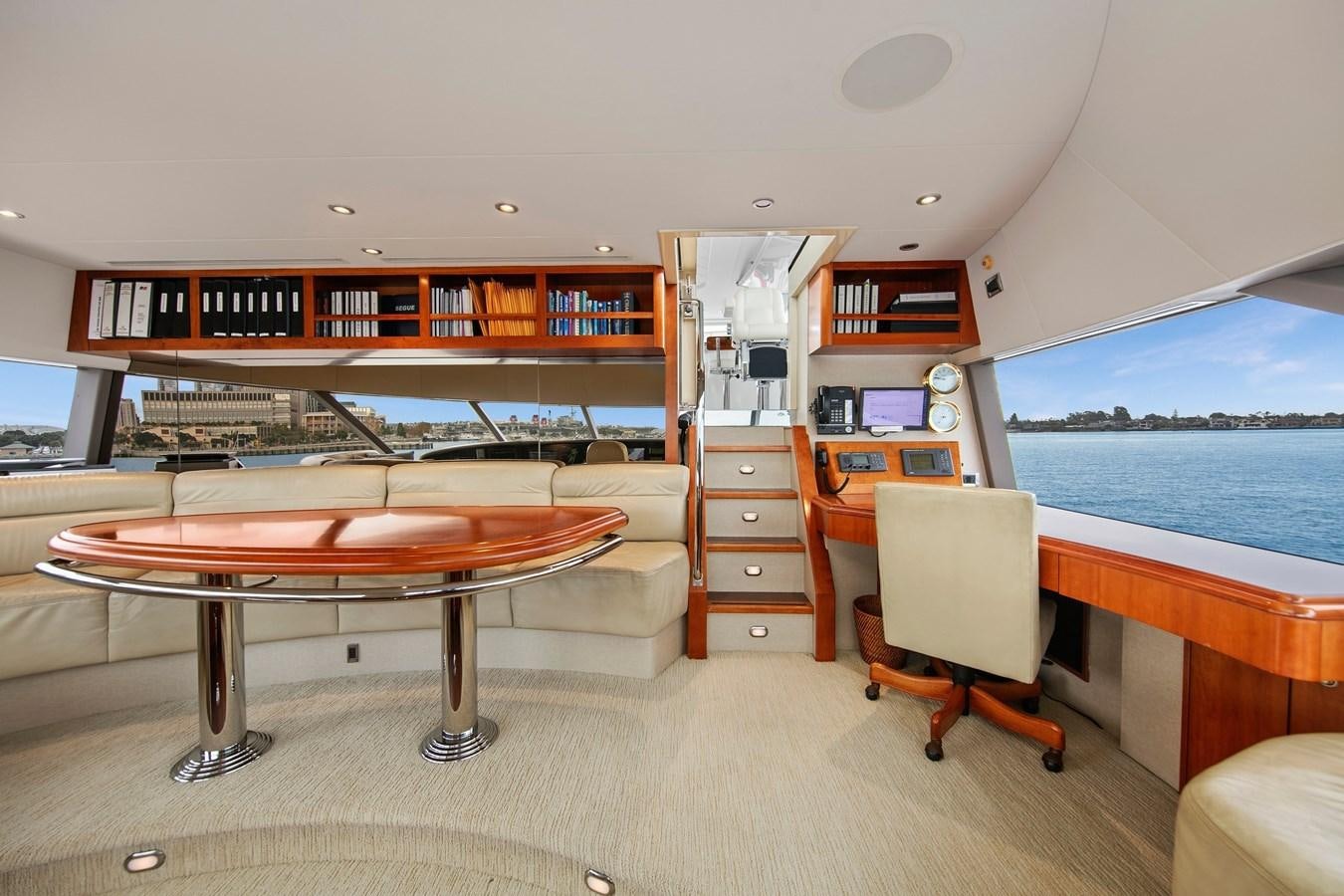 a room with a table and chairs aboard DESPERADO Yacht for Sale