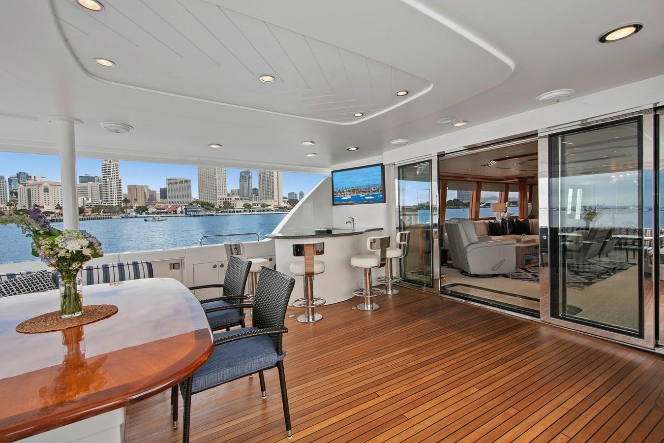 a large open living room with a large pool and a large window aboard DESPERADO Yacht for Sale