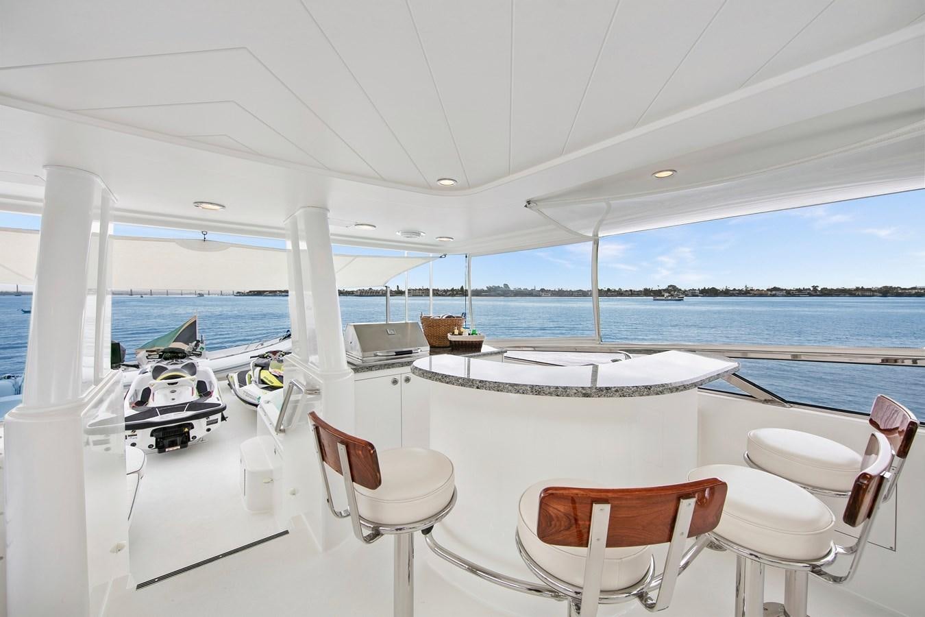a boat with white chairs and tables on it aboard DESPERADO Yacht for Sale