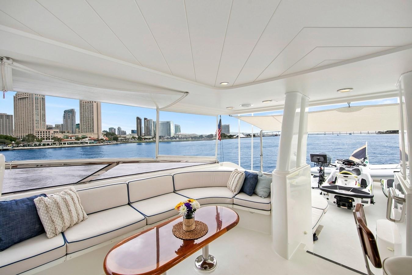 a room with a view of the water and a city aboard DESPERADO Yacht for Sale