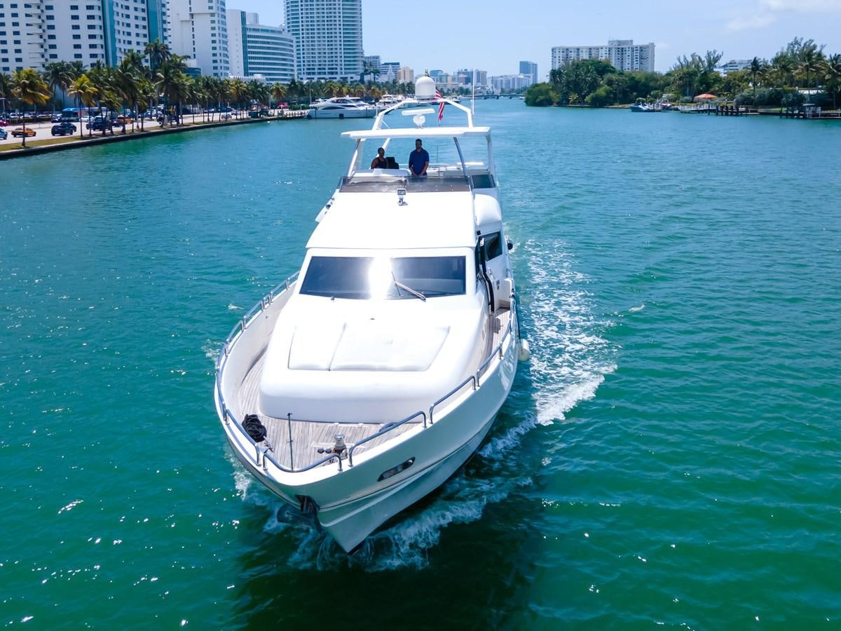 a white boat on the water aboard OLD SPORT II Yacht for Sale